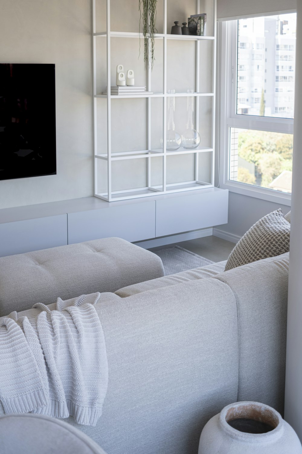 Living room in neutral tones with a large window