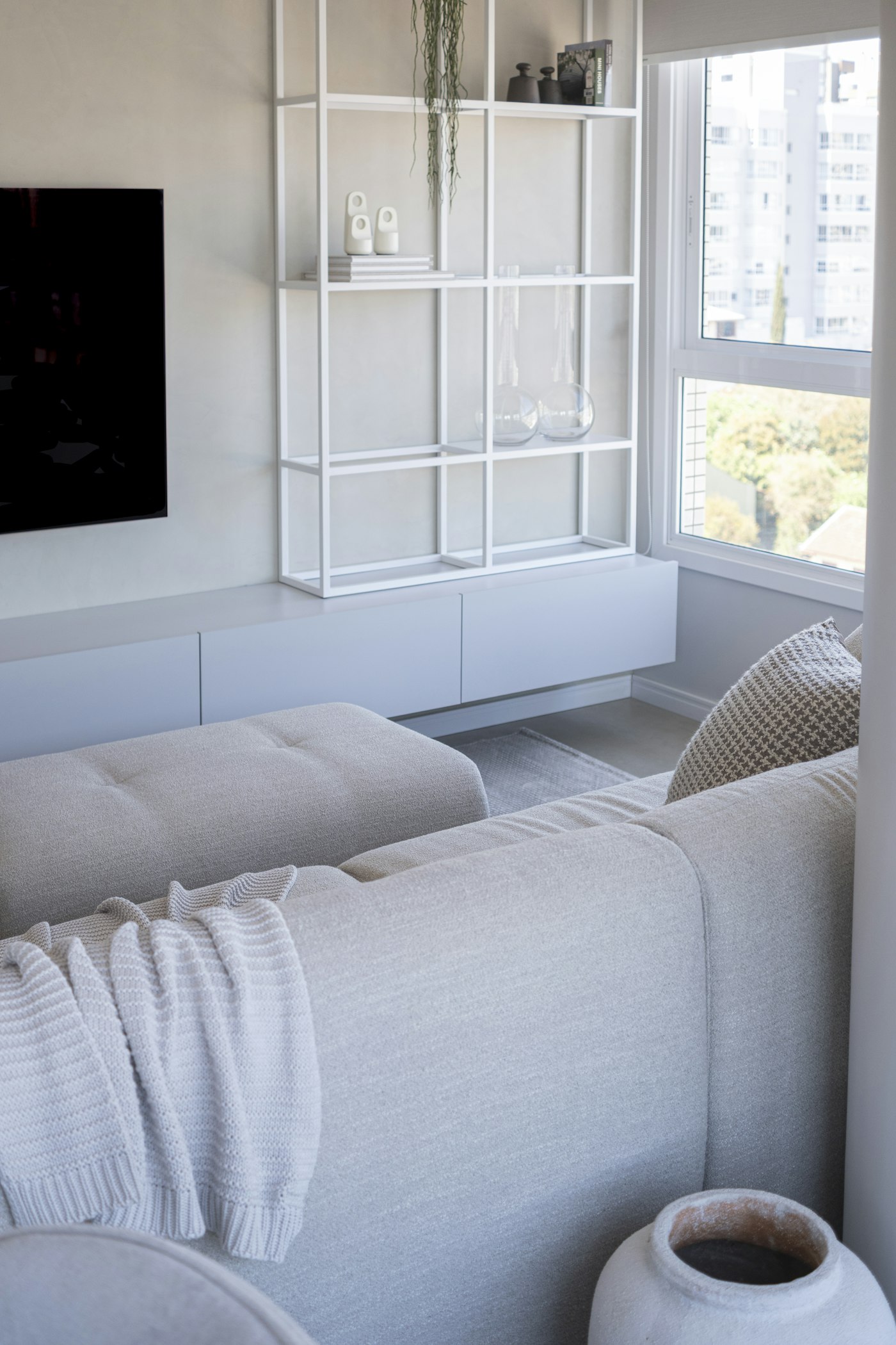 Living room in neutral tones with a large window